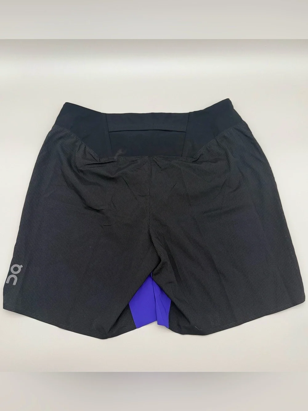 On Running Black Waistband blue and black Men Running Shorts size men’s Medium.
